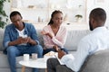 Smartphone Addiction. Annoyed African Wife Complaining About Indifferent Husband To Family Counselor Royalty Free Stock Photo