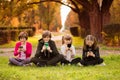 Smartphone addiction group of children watching film movie cartoon together on digital tablet. Kids playing with phone Royalty Free Stock Photo