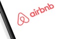 Airbnb logo on the screen