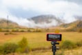 Smartphone Attached to Tripod, Filming Time-Lapse Video in Progress