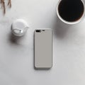 Smartphone with blank screen and coffee cuple table - top view, flat lay