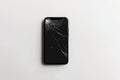 Smartphone with broken black screen on white background Royalty Free Stock Photo