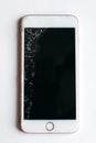 smartphone with a broken screen on a white