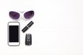 Smartphone, car key, glasses lipstick Royalty Free Stock Photo