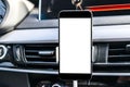 Smartphone in a car use for Navigate or GPS. Driving a car with Smartphone in holder. Mobile phone with isolated white screen. Royalty Free Stock Photo