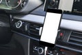 Smartphone in a car use for Navigate or GPS. Driving a car with Smartphone in holder. Mobile phone with white screen. Royalty Free Stock Photo