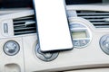 Smartphone in a car use for Navigate or GPS. Driving a car with Smartphone in holder. Mobile phone white screen. Blank Royalty Free Stock Photo