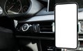 Smartphone in a car use for Navigate or GPS. Driving a car with Smartphone in holder. Mobile phone with  white screen. Bla Royalty Free Stock Photo