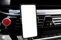 Smartphone in a car use for Navigate or GPS. Driving a car with Smartphone in holder. Mobile phone with  white screen. Bla Royalty Free Stock Photo