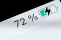 Smartphone charged battery level indicator - 72 percent: close up macro