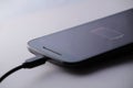 Smartphone charging battery with micro usb cable Royalty Free Stock Photo
