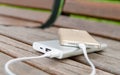Smartphone charging with powerbank on the bench