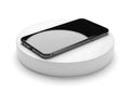 Smartphone charging on wireless pad isolated on white background Royalty Free Stock Photo