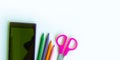 Smartphone colored pencils scissors on white background.copyspace for text Royalty Free Stock Photo