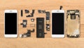 Smartphone components on wooden background Royalty Free Stock Photo