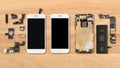 Smartphone components on wooden background Royalty Free Stock Photo