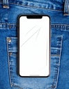 Smartphone with Cracked Screen in Blue Denim Jeans Back Pocket Close Up Royalty Free Stock Photo