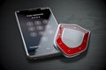 Smartphone data security and protection concept. Mobile phone with shield and password on the screen