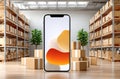 Smartphone display in a modern warehouse environment with stacked cardboard boxes Royalty Free Stock Photo