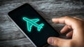 Smartphone displaying airplane mode icon, ideal for travel, communication, and technology projects Royalty Free Stock Photo