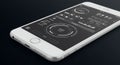 A smartphone displaying a high-tech interface, featuring circular diagrams, buttons, Royalty Free Stock Photo