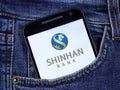 Smartphone displaying logo of Shinhan Bank, a bank headquartered in Seoul, South Korea Royalty Free Stock Photo