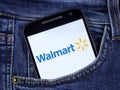 smartphone displaying logo of Walmart Inc., an American multinational retail corporation headquartered in Bentonville, Arkansas Royalty Free Stock Photo