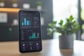 Smartphone displaying network connection data and growth graph digital symbolizing financial, market trend and power usage on Royalty Free Stock Photo