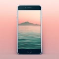 Smartphone Displaying Serene Mountain Seascape at Dawn
