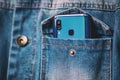 Smartphone with dual camera lens on the jeans pocket Royalty Free Stock Photo