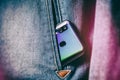 Smartphone with dual camera lens on the jeans pocket Royalty Free Stock Photo