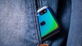 Smartphone with dual camera lens on the jeans pocket Royalty Free Stock Photo