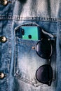 Smartphone with dual camera lens on the jeans pocket Royalty Free Stock Photo