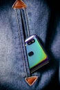 Smartphone with dual camera lens on the jeans pocket Royalty Free Stock Photo