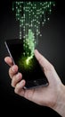 Smartphone emits green binary code, emphasizing digital and futuristic themes Royalty Free Stock Photo