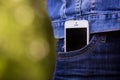 Smartphone in everyday life. phone in jeans pocket. Royalty Free Stock Photo