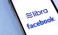 Smartphone with Facebook and Libra logo
