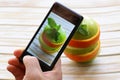 Smartphone food photo - slices apple and orange Royalty Free Stock Photo
