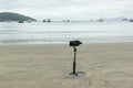 Smartphone in the gimbal filming the beach and boats. Royalty Free Stock Photo