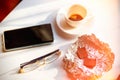 Smartphone, glasses, a Cup of unfinished morning coffee, and chocolate. The concept of morning news, Loneliness. Tinted Royalty Free Stock Photo