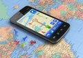 Smartphone with GPS navigation on world map Royalty Free Stock Photo