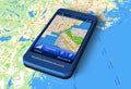 Smartphone with GPS navigator on map Royalty Free Stock Photo