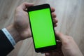 Smartphone with green screen for key chroma Royalty Free Stock Photo