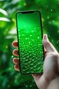 Smartphone with green screen hold in masculine hand