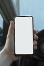 Smartphone in hand driver while driving. Isolated screen for mockup