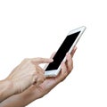 Smartphone in hand with finger on touch screen isolated on white background Royalty Free Stock Photo