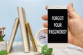 Smartphone in hand with the inscription Forgot your password