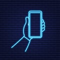 Smartphone on hand. Telephone icon. Neon icon. Touchscreen, Phone display. Cell phone. Vector illustration.