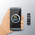 Smartphone in hand and wristband fitness tracker with counting steps app. Walk steps counter app on cellphone and Royalty Free Stock Photo