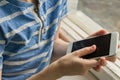 Smartphone in the hands of a child. A schoolboy plays games on the phone